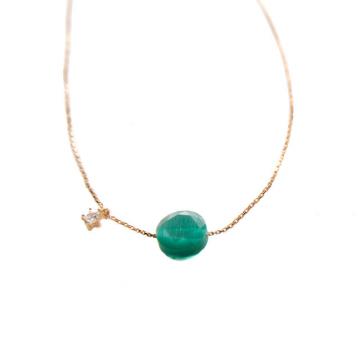 Gold colored necklace with green stone
