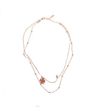 Rose gold colored necklace with clover